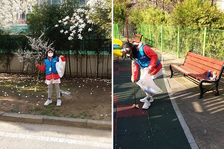 꿈기자가 쓰레기를 줍고 있다.